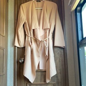 Fashion coat, ruffle and waist tie.